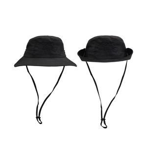Detail of adjustable black sun hat with mountain embroidery and side snaps for hiking