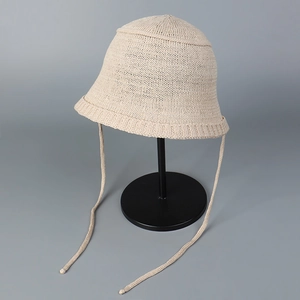 Detailed close-up of breathable knit bucket hat showing soft texture and side straps
