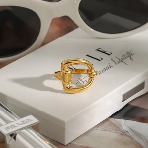 Close-up of 18k gold plated stainless steel horsebit ring with a mirror finish