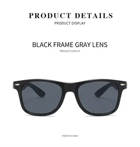 Front view of classic oversized black square sunglasses with grey lenses and rice studs