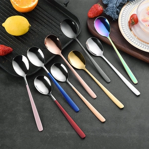Close-up of multicolored 304 stainless steel heart-shaped spoons with long handles