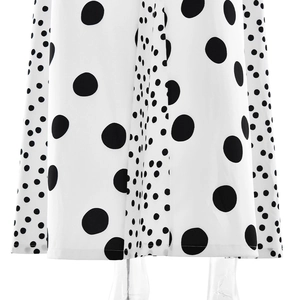Close-up of lightweight white dress hem featuring black polka dot pattern and fine texture