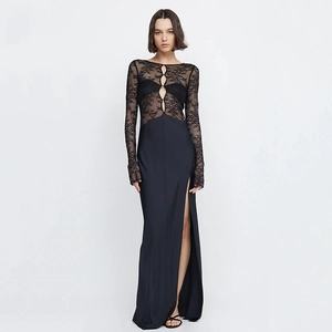 Detail of black lace patchwork bodice and elegant high side slit on slim fit dress