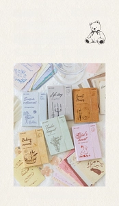 Detail of vintage scrapbooking stickers featuring retro illustrations on specialty paper