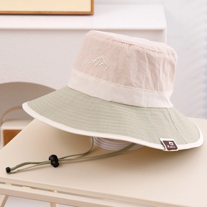 Close-up of kids sun hat with The Explorer embroidery and adjustable chin strap