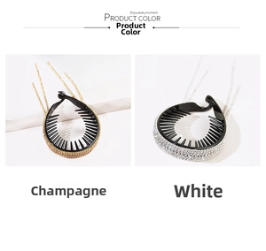 Detail view of rhinestone tassel banana hair clips in champagne and white color options
