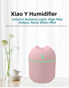 Pink portable humidifier with colorful LED light and nano mist technology on a desk