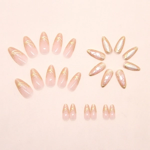 Detailed flat lay of golden pearl aurora press-on nails in long almond shape