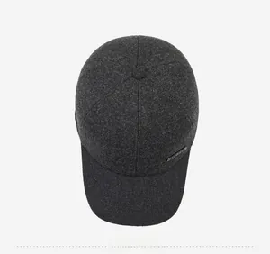 Detailed top view of dark grey winter baseball cap showing thick textured wool fabric