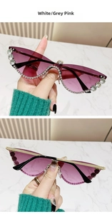 Detail of cat eye rimless sunglasses with rhinestone edges and grey pink gradient lenses