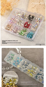 Macro detail of high-transparency 12-grid nail art storage box with independent lids
