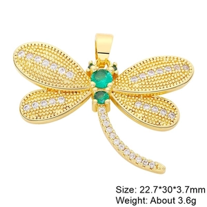 Detailed view of dragonfly pendant with green stones and clear crystals, 22.7x30mm size