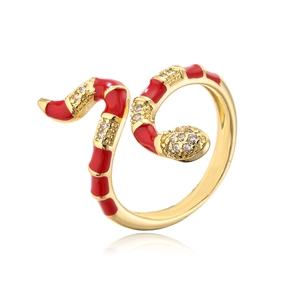 Detail of snake ring with 18K gold plating, red enamel oil, and white zircon settings