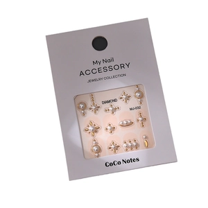 Golden bronzing nail art stickers with faux pearls and stars in MJ-032 retail packaging