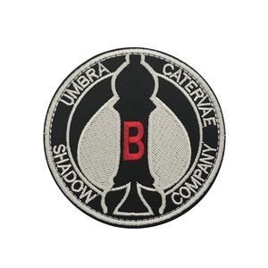 Tactical Shadow Company embroidered morale patch with red B and military Velcro back