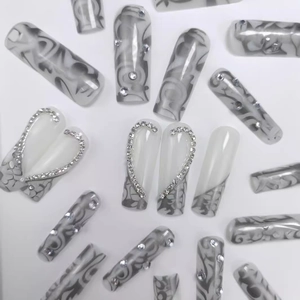 Long coffin press on nails featuring grey marble texture and sparkling rhinestone heart