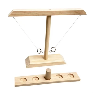 Detail of wooden ring toss game components featuring clear wood grain and hooks