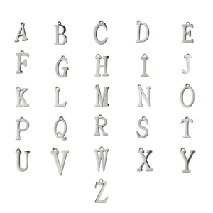 Detailed macro view of 26 polished stainless steel alphabet charms for DIY jewelry making