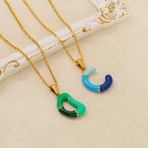 Colorful drip oil letter necklace with gold-plated pendants on vintage photo frame
