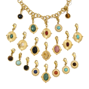 Detail showing gold stainless steel bracelet with diverse colorful gemstone sun pendants