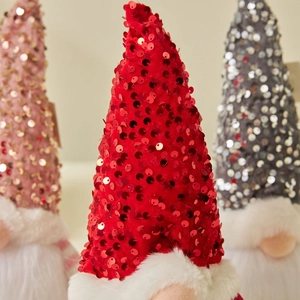Three festive Christmas gnomes with red sequin hats and white faux fur beards decor