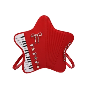 Unique red star-shaped crossbody bag with piano key pattern and silver bow detail