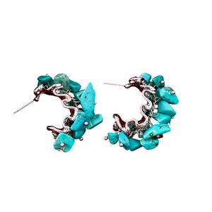 Vintage silver earrings with irregular turquoise stone beads in a C-shape hoop design