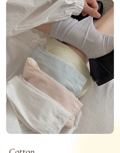 Close-up of lightweight silk socks in soft pastel colors showing cotton fabric texture