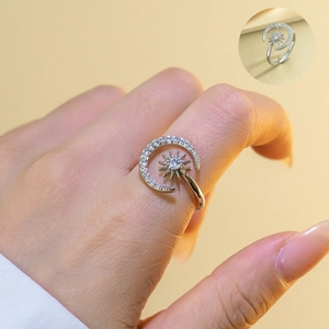 Detail of sun and moon adjustable ring featuring sparkling zircons on silver band