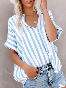 Detailed view of women's short sleeve V-neck blouse with blue and white stripes and buttons