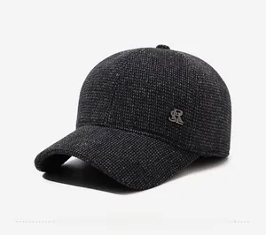 Detailed view of the dark grey wool texture and small metal SR logo on the baseball cap