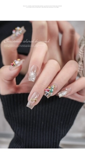 Macro shot of 3D Christmas nail art charms with festive snowflake and star motifs