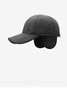 Close-up of winter wool baseball cap with ear flaps and Fashion logo plaque