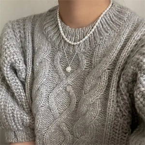 Close-up of double-layer 925 silver necklace with elegant freshwater pearl pendants