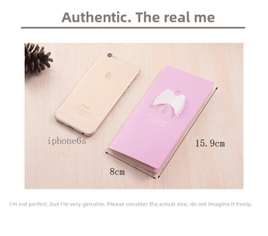 Detailed size comparison of pink 3D winged greeting card next to a smartphone