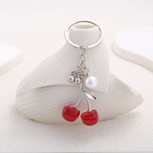 Sweet red cherry keychain with white pearl on silver ring and seashell decor