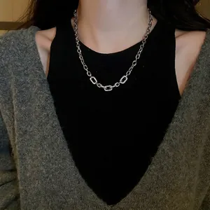 Zircon geometric silver necklace with thick chain links worn on model neck