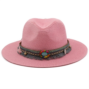 Detail of pink straw fedora with bohemian band featuring beads, tassels and turquoise