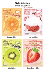 Detail of creative fruit-shaped sticky notes showing realistic kiwi and strawberry textures