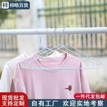 Detail of wavy non-slip metal clothes hanger with PVC coating for secure garment hanging