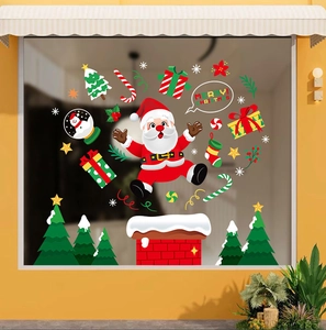 Christmas window stickers featuring cartoon Santa Claus, snowman, and holiday gift boxes