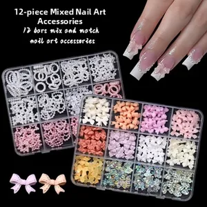 Close-up of 12-grid nail art charms set featuring alloy rivets and pearl bowknot details