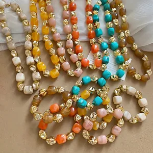 Bohemian irregular acrylic beaded bracelet with colorful resin charms and golden beads