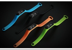 Waterproof LED digital watches in blue, black, orange, and green colors with silicone bands