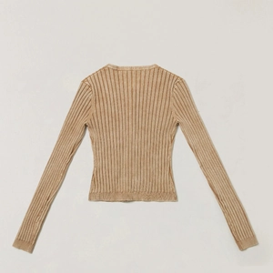 Close-up of khaki ribbed knit cardigan showing textured vertical lines and slim fit design
