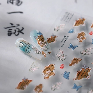 Chinese style nail stickers featuring blue butterflies and orchids on clear fake nails