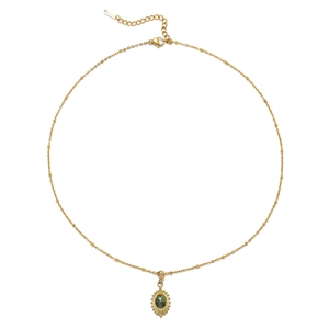 Detail of gold beaded satellite chain with green teardrop stone pendant and clasp
