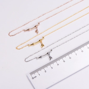Detail view of 2.5cm bamboo knot pendant necklaces in gold, rose gold and silver finish