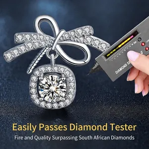 925 sterling silver bow earrings with round moissanite pendant and diamond tester focus
