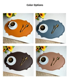 Detail showing wavy edges and dot embossing on four assorted color faux leather placemats